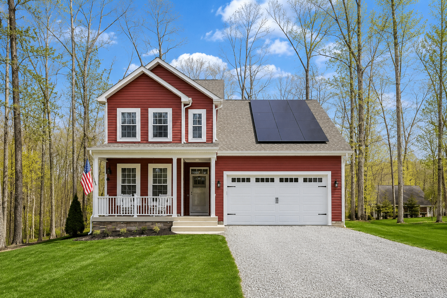 Custom red two-story home with covered porch, solar panels and two-car garage in Central Virginia